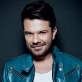 Кенан Доğулу